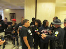 Capitol Police appear to be telling members of Dream Defenders to be quiet or leave during a raucous protest outside the House and Senate chambers on the opening day of the 2014 legislative session. Photo by Bruce Ritchie.