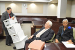 Former U.S. Attorney Greg Miller hauls files out of court Wednesday as former Supreme Court Justice Gerald Kogan and Leon County Judge Judith Hawkins wait to pack up. Photo by Bill Cotterell.