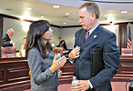 Sarasota County Clerk of Court Karen Rushing talks with DOC Secretary Michael Crews after their presentations Monday to the Senate Criminal Justice Committee about forged release papers. Photo by Bill Cotterell.