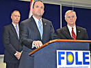 Agent Danny Banks, in charge of the FDLE's Orlando office, speaks at a news conference Thursday with Department of Corrections Secretary Mike Crews, left, and FDLE Commissioner Gerald Bailey. Photo by Bill Cotterell.