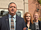 Liberty County Sheriff Nick Finch speaks on the Liberty County Courthouse steps Thursday after his acquittal. His wife Angela and daughter Amber, 16, stand with Finch. Photo by Bill Cotterell.