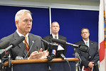 Commissioner Gerald Bailey of the FDLE discusses the recapture during a news conference at FDLE headquarters Sunday. DOC Secretary Mike Crews, center, Jeff Duncan, of the FDLE Pensacola office, attend. Photo by Bill Cotterell.