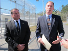 Department of Corrections Secretary Mike Crews talks about the new Gadsden Re-entry Center on Tuesday while as deputy secretary Tim Cannon listens. Photo by Bill Cotterell.