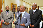 State Rep. Alan Williams speaks at a news conference on Tuesday with state Sen. Dwight Bullard, left, attorney Benjamin Crump of Tallahassee and the Rev. R.B. Holmes of Tallahassee. Photo by Bill Cotterell.