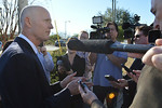 Upon returning to Tallahassee on Tuesday afternoon, Gov. Rick Scott answers questions from the Capitol press corps  about his selection of former Rep. Carlos Lopez-Cantera as his lieutenant governor. Photo by Bill Cotterell.