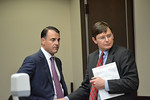 Republican campaign consultant Marc Reichelderfer speaks with his attorney, David Healy, at the witness stand during a break in the redistricting trial on Monday. Photo by Bill Cotterell