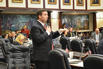 Rep. Jake Raburn discusses his bill banning collection of student "biodata" on Wednesday during House debate. Photo by Bill Cotterell.