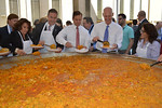 Chief Financial Officer Jeff Atwater, Lt. Gov. Carlos Lopez Cantera and Gov. Rick Scott dish up paella from a 10-foot wok during Miami-Dade Day at the Legislature. Photo by Bill Cotterell.