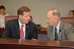 Sen. Andy Gardiner and Rep. Ed Hooper talk during a Transportation and Economic Development conference meeting.  Photo by Bill Cotterell,