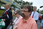 Gloria C. Mackenzie, center, holds her son Scott's arm as they leave the Department of the Lottery Wednesday after cashing in the $590.5 million Powerball ticket for a lump sum of $370,896,780. Photo by Bill Cotterell.