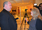 Pam Olsen, organizer behind the Nativity set up in the Capitol rotunda last week, welcomes Chaz Stevens and his "Festivus" pole on Wednesday. Photo by Bill Cotterell.